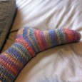 On reaching a new level of knitting skills, finishing my first pair of socks, and learning to knit left-handed.