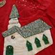 My grandma made this super shiny tree skirt using felt, sequins, beads and ric rac. 