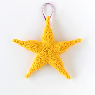 Knit Star Ornament - Click through for a free knitting pattern for this cute star ornament, which also makes a great tree star, gift topper or baby toy!