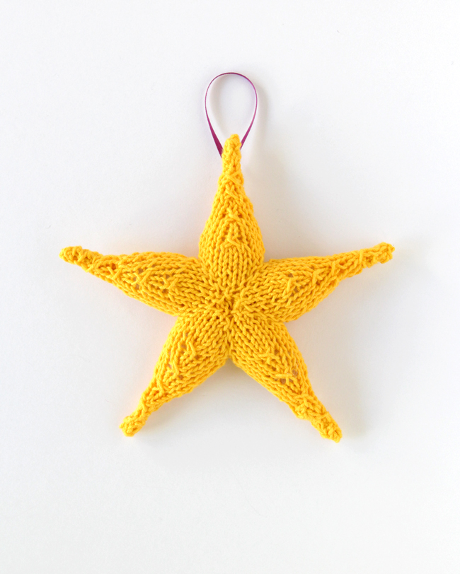 Knit Star Ornament - Click through for a free knitting pattern for this cute star ornament, which also makes a great tree star, gift topper or baby toy! 