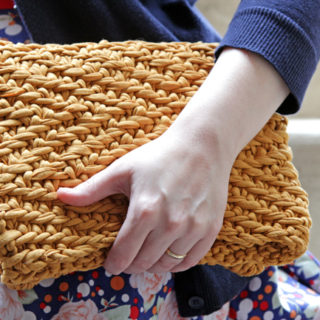 Get your hands on the free pattern to knit this versatile foldover clutch out of fabric yarn!