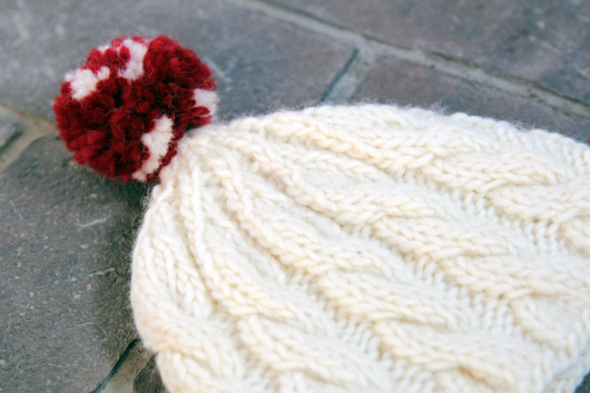 Knit an adorable cable knit beanie for winter with this free pattern that comes in adult and children's sizes. 