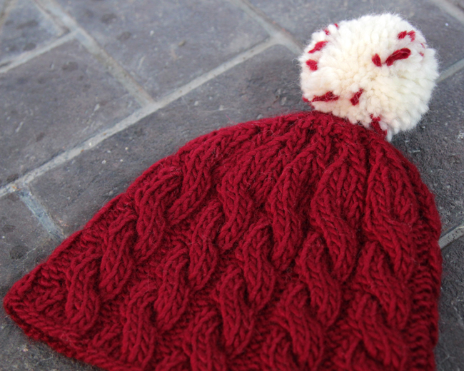 Knit an adorable cable knit beanie for winter with this free pattern that comes in adult and children's sizes. 