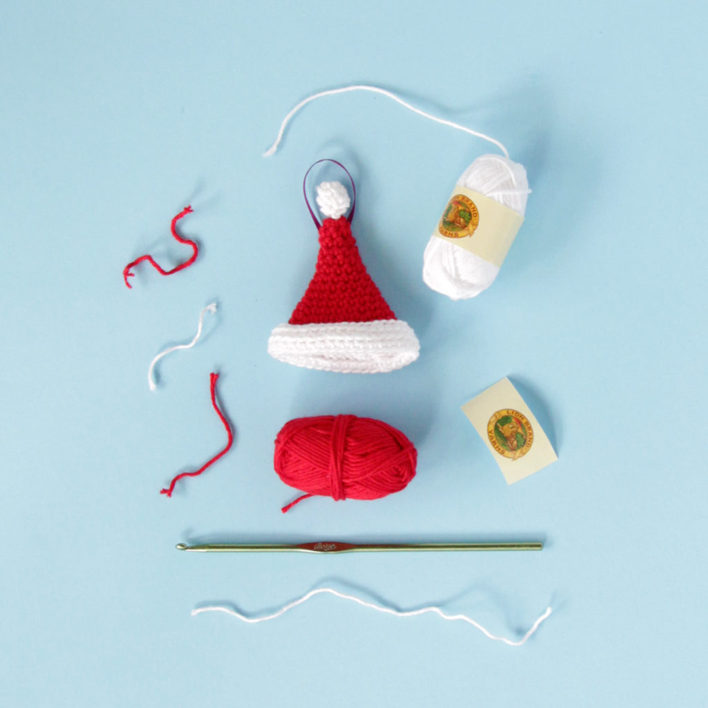 Crochet a jaunty Santa hat ornament with this free amigurumi pattern.