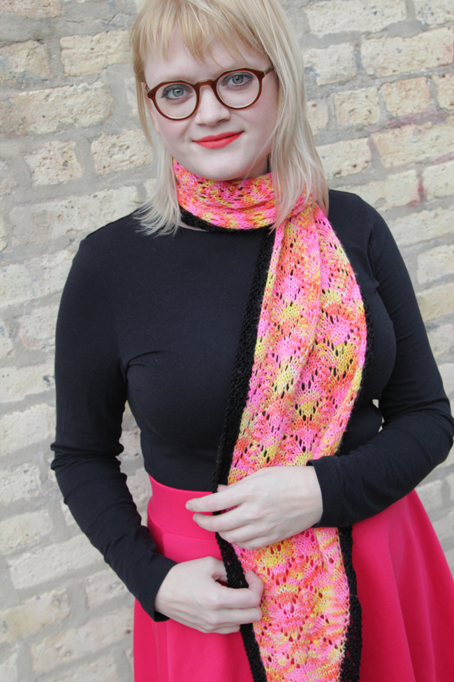 Knit Designer Heidi Gustad modeling the Rhombuster Scarf pattern, available on Ravelry.