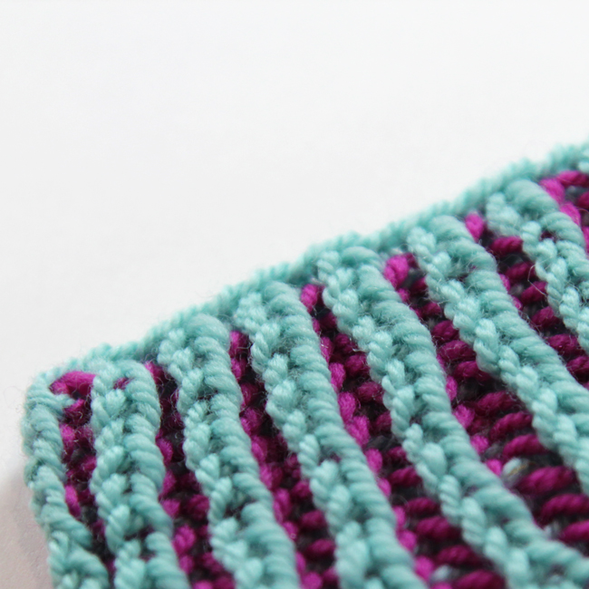Demystify flat two color brioche rib knitting with this easy to follow video tutorial featuring Heidi Gustad from the blog Hands Occupied.