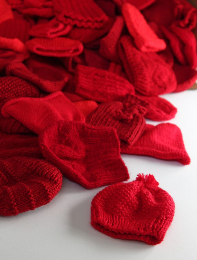 Little Hats Big Hearts pairs newborns with red hats and life saving information every year during American Heart Month. Click through for free patterns and donation information.