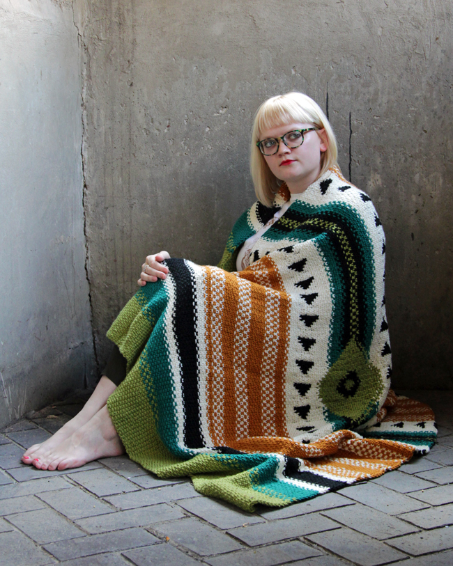 The Arizona Afghan is a single panel blanket inspired by iconic woven blankets of the American Southwest. The bold, graphic design of this throw is accomplished through a combination of linen stitch, stranded colorwork, slipped stitches and a dash of intarsia. Get the pattern in I Like Knitting magazine.