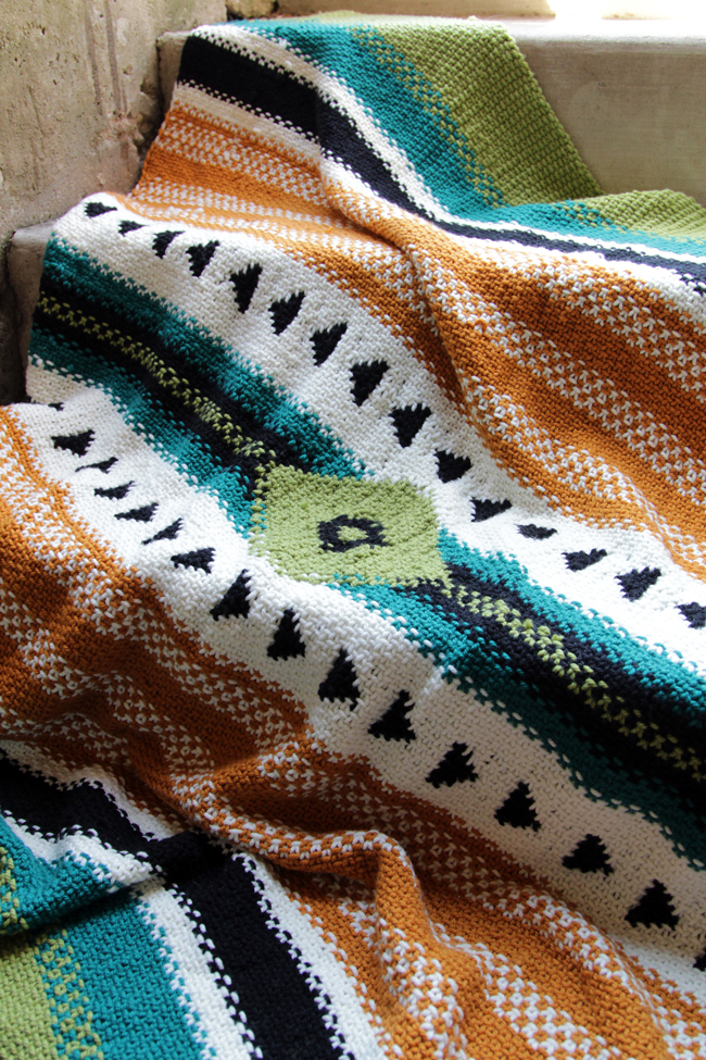 The Arizona Afghan is a single panel blanket inspired by iconic woven blankets of the American Southwest. The bold, graphic design of this throw is accomplished through a combination of linen stitch, stranded colorwork, slipped stitches and a dash of intarsia. Get the pattern in I Like Knitting magazine.