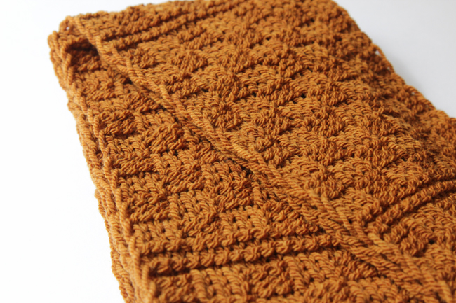 Get your hands on a free knitting pattern for the Golden Check Infinity Scarf!