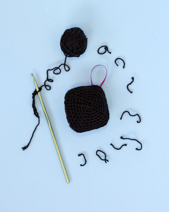 Have a little fun with your handmade gifts this holiday! Crochet an amigurumi coal ornament for your Christmas tree or as a funny stocking stuffer with this free pattern.