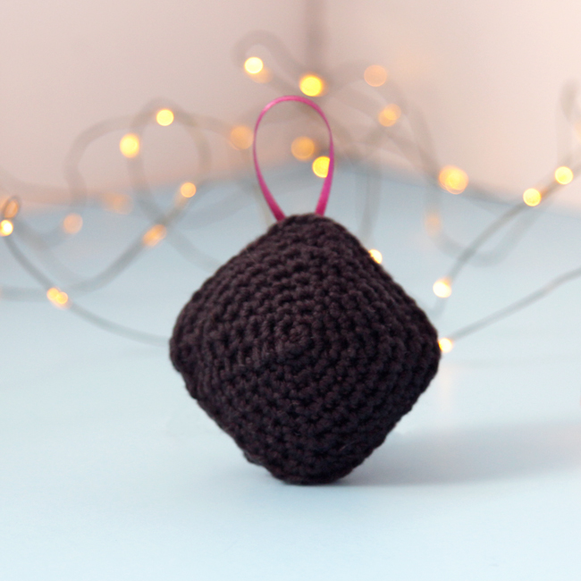 Have a little fun with your handmade gifts this holiday! Crochet an amigurumi coal ornament for your Christmas tree or as a funny stocking stuffer with this free pattern.