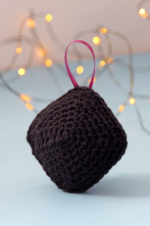 Have a little fun with your handmade gifts this holiday! Crochet an amigurumi coal ornament for your Christmas tree or as a funny stocking stuffer with this free pattern.