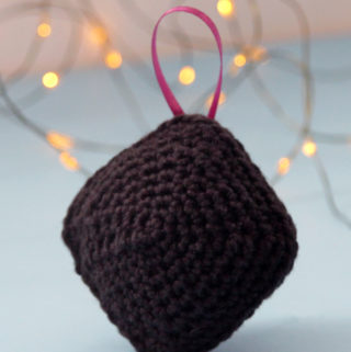 Have a little fun with your handmade gifts this holiday! Crochet an amigurumi coal ornament for your Christmas tree or as a funny stocking stuffer with this free pattern.