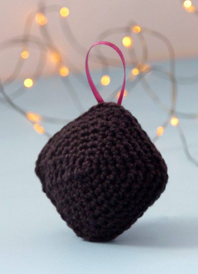 Have a little fun with your handmade gifts this holiday! Crochet an amigurumi coal ornament for your Christmas tree or as a funny stocking stuffer with this free pattern.