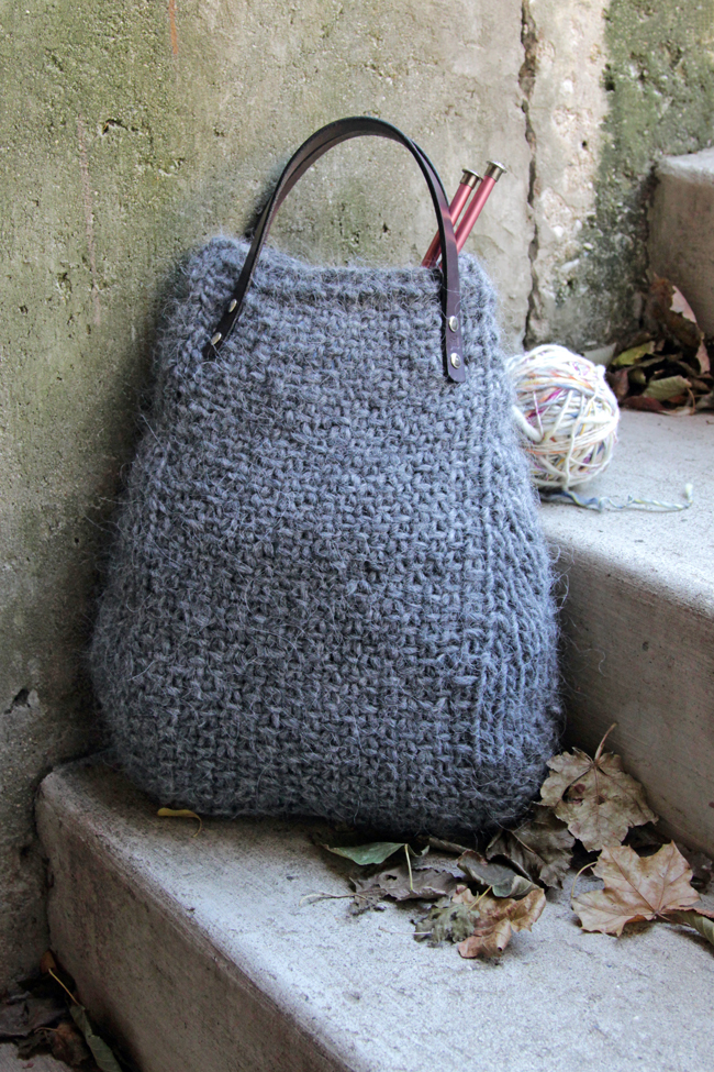 The Lopi Tote makes use of bulky yarn and elegant, screw-in handles to create a deep bag with a wide base that knits up quick. Get your hands on this free pattern, designed with knitters in mind. The Lopi Tote is perfect for carrying your next knitting project on the go!