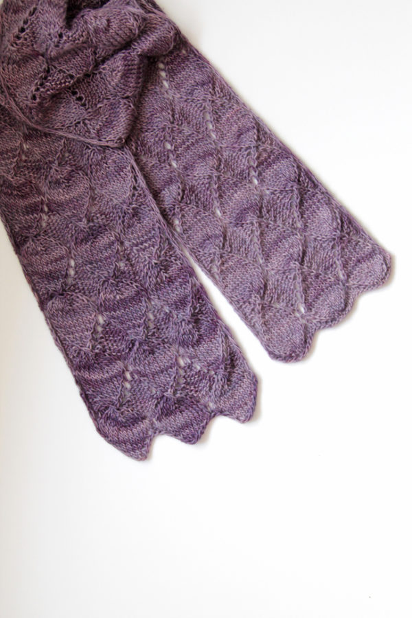 Get your hands on the Ruby Stole knitting pattern by Heidi Gustad. Featuring short rows, easy lace and tons of gorgeous texture, the Ruby Stole is a fun, fast single skein knitting pattern. Find it on Ravelry or in the Hands Occupied Pattern Shop.