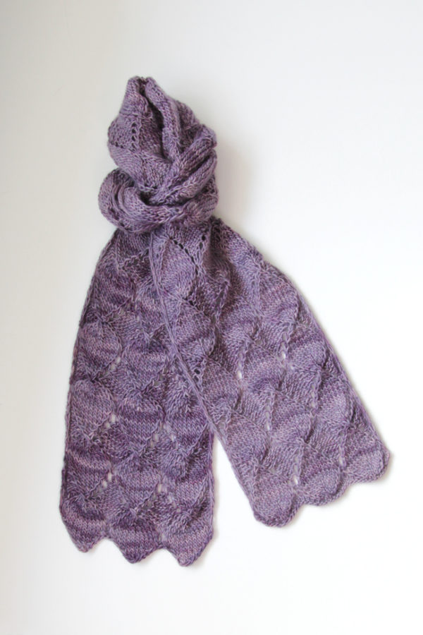 Get your hands on the Ruby Stole knitting pattern by Heidi Gustad. Featuring short rows, easy lace and tons of gorgeous texture, the Ruby Stole is a fun, fast single skein knitting pattern. Find it on Ravelry or in the Hands Occupied Pattern Shop.