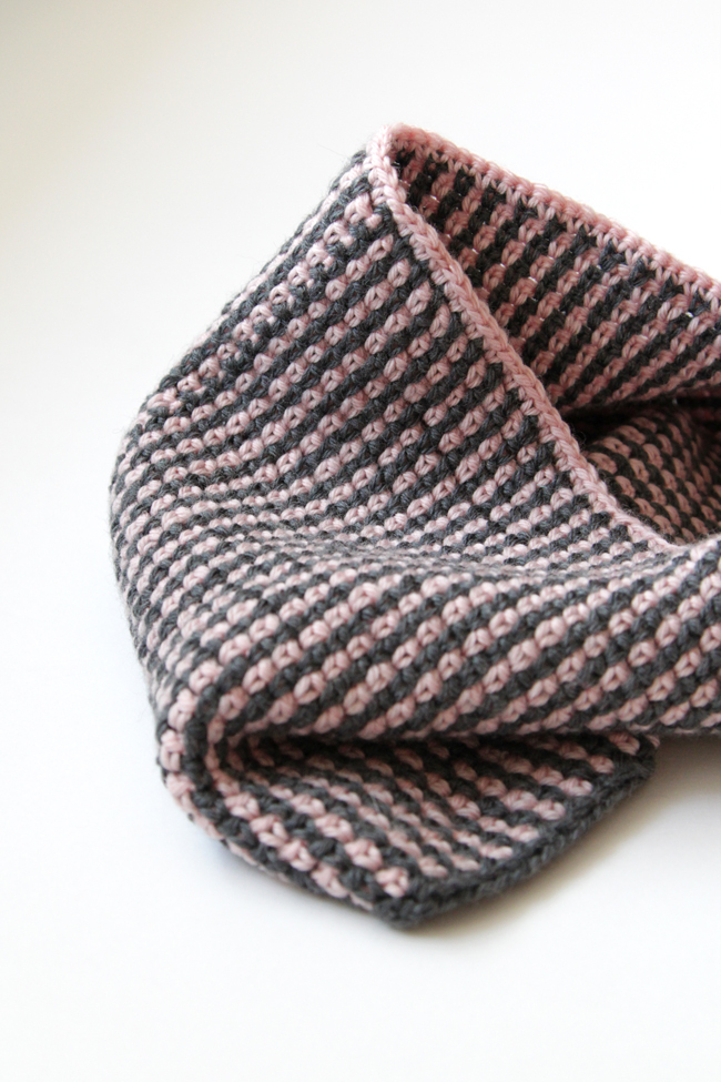 This cute, two-color cowl is crocheted with just two 50g balls of 100% wool yarn. Get the free Moss Stitch Cowl pattern from Hands Occupied.