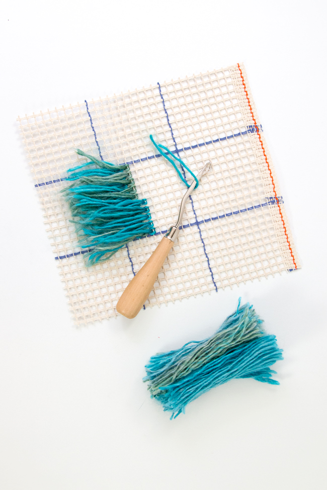 Learn how to latch hook with an easy-to-follow tutorial. Make wall hangings, throw pillows, rugs, and more! Latch hook projects are a great use for scrap yarn too. 
