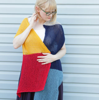 Who doesn't love an easy-to-knit, versatile pattern? The Wherever Wrap is a fun colorblock piece knit with a simple lace motif. Get the free knitting pattern by designer Heidi Gustad.