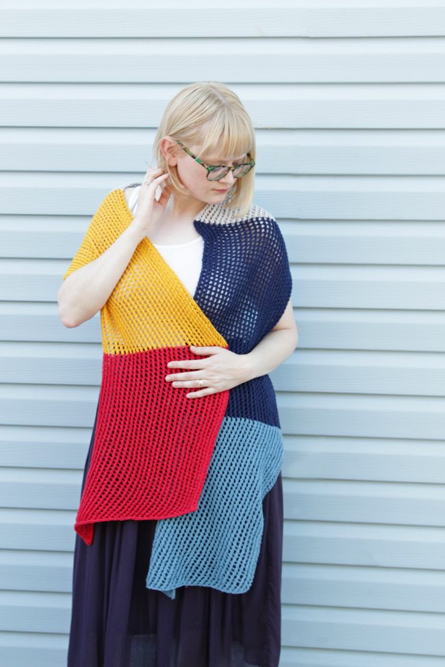 Who doesn't love an easy-to-knit, versatile pattern? The Wherever Wrap is a fun colorblock piece knit with a simple lace motif. Get the free knitting pattern by designer Heidi Gustad. 