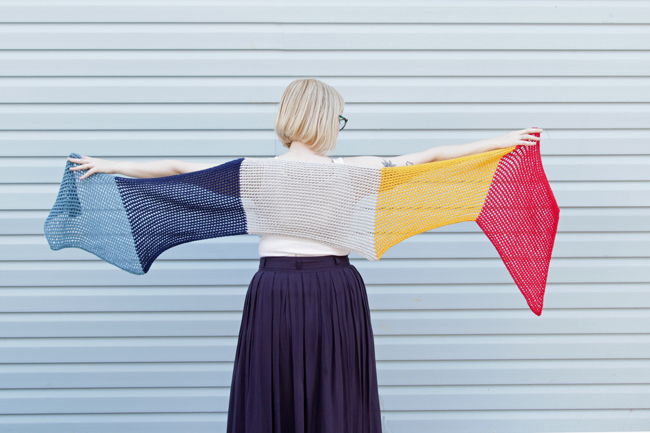 Who doesn't love an easy-to-knit, versatile pattern? The Wherever Wrap is a fun colorblock piece knit with a simple lace motif. Get the free knitting pattern by designer Heidi Gustad. 