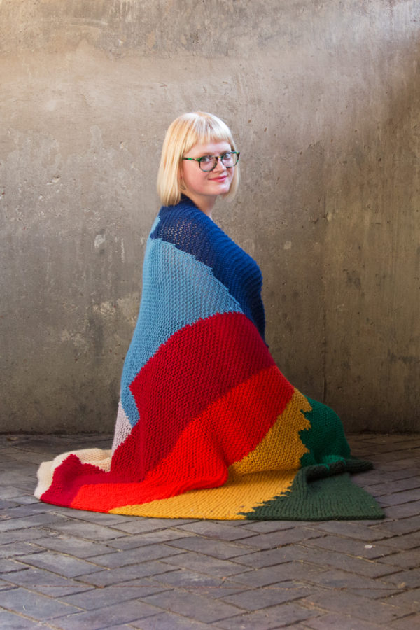 Intarsia Mountain by Heidi Gustad is a knitting pattern worked primarily in garter stitch and features a beautiful landscape formed using color and geometric lines.