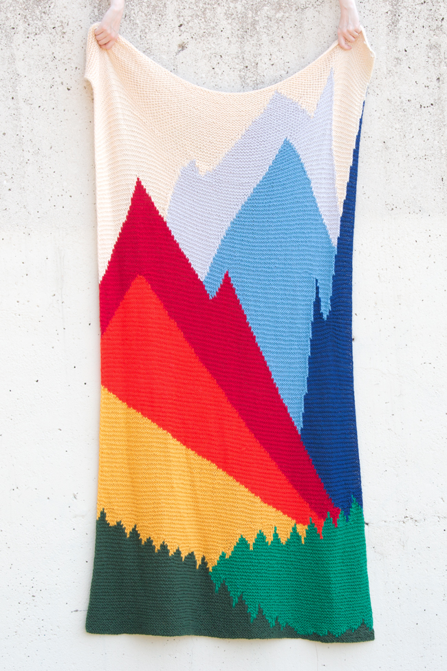 Intarsia Mountain by Heidi Gustad is a knitting pattern worked primarily in garter stitch and features a beautiful landscape formed using color and geometric lines.