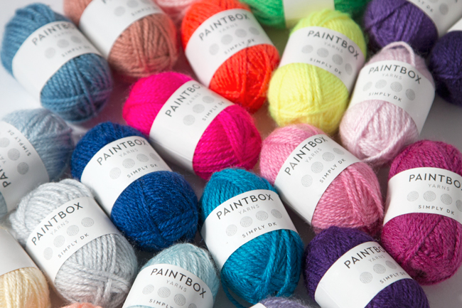 Mini skeins are a great way to put together sample color palettes for knitting and crochet projects. Get inspired with five color palettes for the 9-color Intarsia Mountain afghan pattern, curated by its designer, Heidi Gustad. 