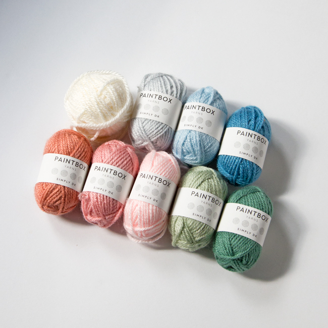 Mini skeins are a great way to put together sample color palettes for knitting and crochet projects. Get inspired with five color palettes for the 9-color Intarsia Mountain afghan pattern, curated by its designer, Heidi Gustad.
