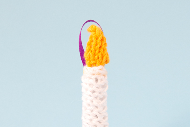 The Knit Candle Ornament can easily be knit in under an hour, making it the perfect little finished object to shoe horn in during the busy Christmas season. Get the free pattern to light up your holiday!