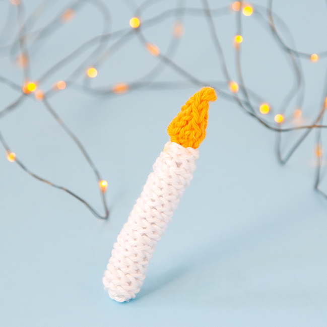 The Knit Candle Ornament can easily be knit in under an hour, making it the perfect little finished object to shoe horn in during the busy Christmas season. Get the free pattern to light up your holiday!