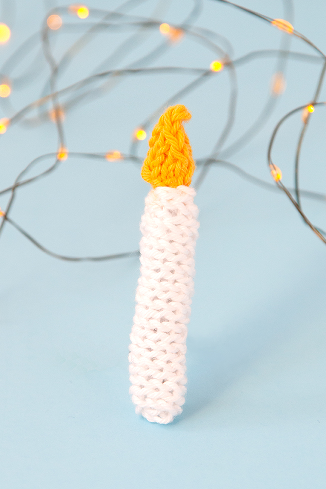 The Knit Candle Ornament can easily be knit in under an hour, making it the perfect little finished object to shoe horn in during the busy Christmas season. Get the free pattern to light up your holiday!