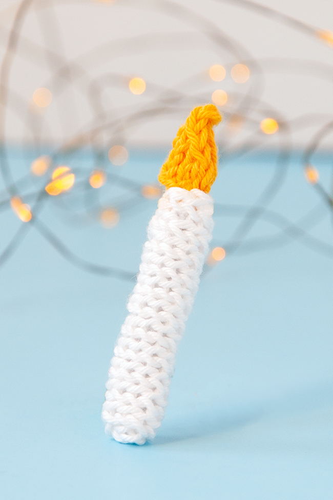 The Knit Candle Ornament can easily be knit in under an hour, making it the perfect little finished object to shoe horn in during the busy Christmas season. Get the free pattern to light up your holiday!