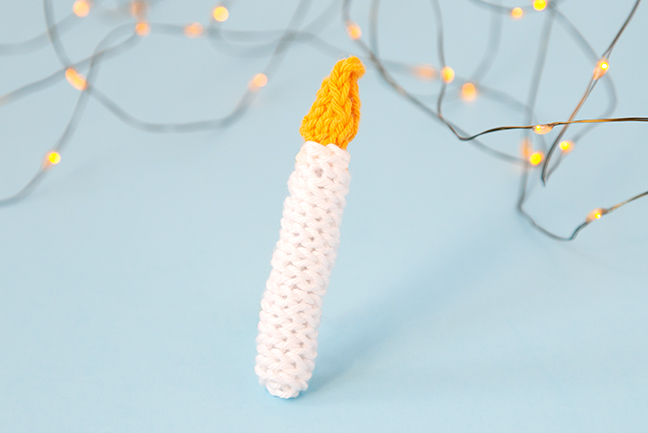 The Knit Candle Ornament can easily be knit in under an hour, making it the perfect little finished object to shoe horn in during the busy Christmas season. Get the free pattern to light up your holiday!