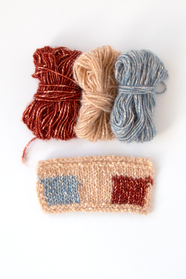 Berroco Brielle yarn in Blond, Bleu & Rouille. Click through to win a kit featuring this yarn and the Checked Snood knitting pattern by Heidi Gustad.