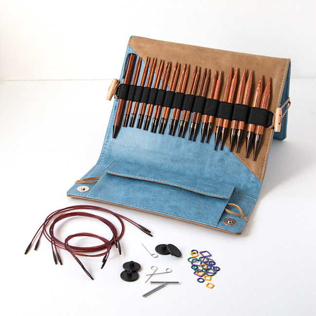 Knitter's Pride's Ginger Interchangeable Circular Needle sets combine beautiful wood and quality accessories into a thoughtful, practical case. Each set contains 13 pairs of needles, a matching pen, a chart holder, 6 sets of cords, and more. Get a closer look with this review from Hands Occupied.