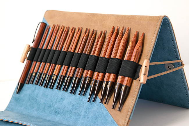 Knitter's Pride's Ginger Interchangeable Circular Needle sets combine beautiful wood and quality accessories into a thoughtful, practical case. Each set contains 13 pairs of needles, a matching pen, a chart holder, 6 sets of cords, and more. Get a closer look with this review from Hands Occupied.