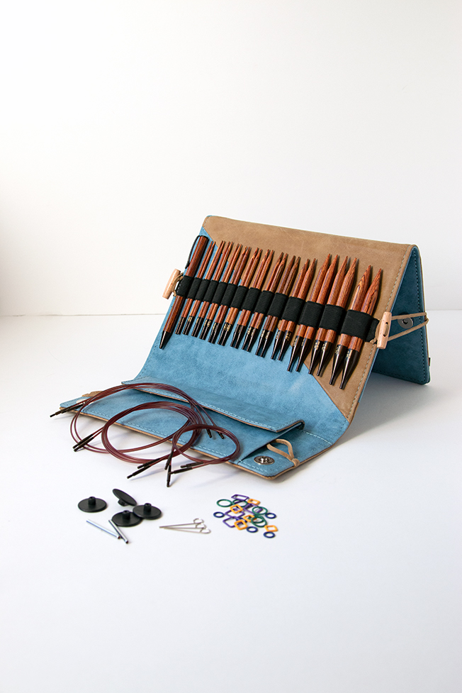 Knitter's Pride's Ginger Interchangeable Circular Needle sets combine beautiful wood and quality accessories into a thoughtful, practical case. Each set contains 13 pairs of needles, a matching pen, a chart holder, 6 sets of cords, and more. Get a closer look with this review from Hands Occupied.