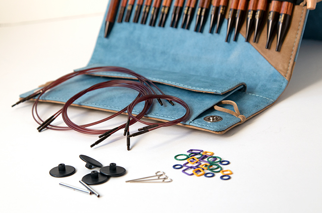 Knitter's Pride's Ginger Interchangeable Circular Needle sets combine beautiful wood and quality accessories into a thoughtful, practical case. Each set contains 13 pairs of needles, a matching pen, a chart holder, 6 sets of cords, and more. Get a closer look with this review from Hands Occupied.