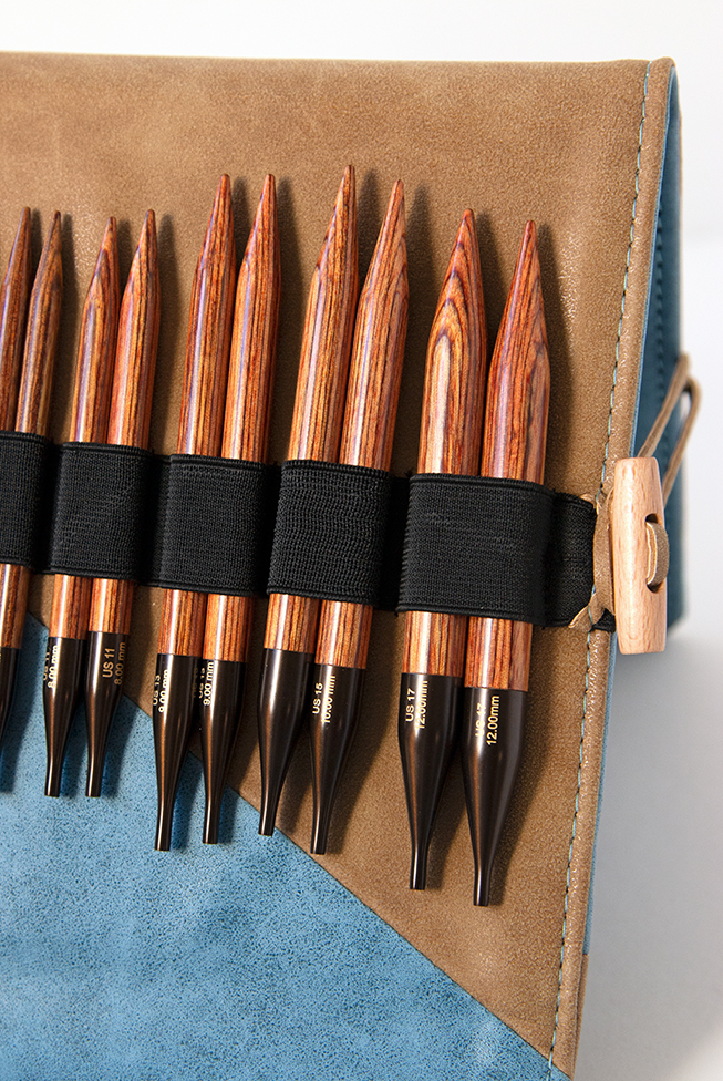 Knitter's Pride's Ginger Interchangeable Circular Needle sets combine beautiful wood and quality accessories into a thoughtful, practical case. Each set contains 13 pairs of needles, a matching pen, a chart holder, 6 sets of cords, and more. Get a closer look with this review from Hands Occupied.