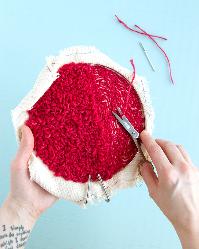 Weaving in your ends on a punch needle project is easy! Check out this step-by-step tutorial for tips and tricks for hiding and securing your punch needle rug hooking tails.