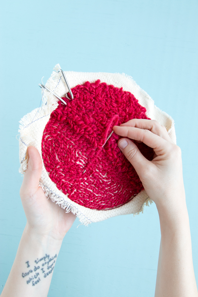 Weaving in your ends on a punch needle project is easy! Check out this step-by-step tutorial for tips and tricks for hiding and securing your punch needle rug hooking tails.