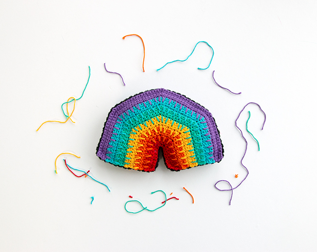 Over the Rainbow Softie, a free crochet pattern using 1 package of Lion Brand Bonbons yarn. Crochet an adorable, on-trend softie toy that easily doubles as DIY nursery decor.
