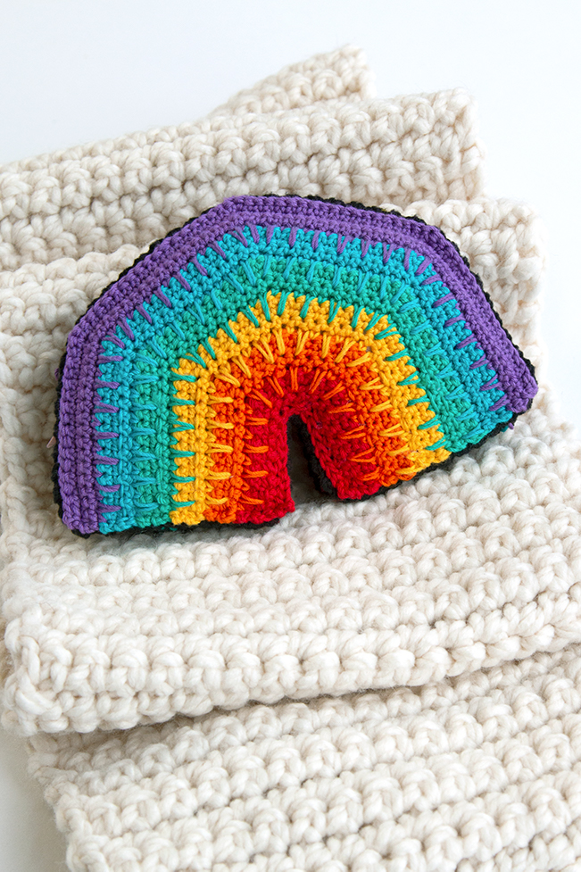 Over the Rainbow Softie, a free crochet pattern using 1 package of Lion Brand Bon Bons yarn. Crochet an adorable, on-trend softie toy that easily doubles as DIY nursery decor.