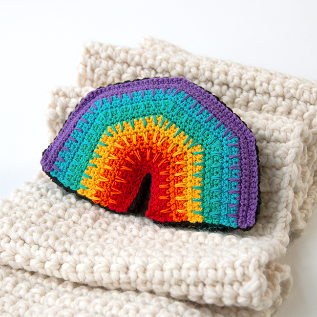 Over the Rainbow Softie, a free crochet pattern using 1 package of Lion Brand Bon Bons yarn. Crochet an adorable, on-trend softie toy that easily doubles as DIY nursery decor.