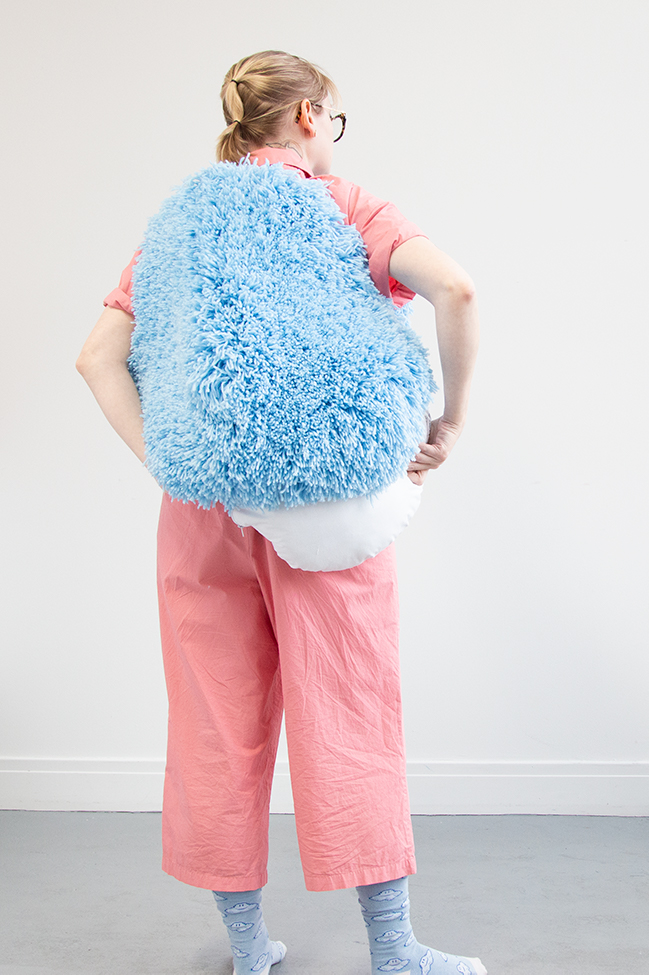 I got this wild idea to make a giant pom pom costume using latch hook, so I gave it a go for Halloween. Take a closer look at this three dimensional rug-making project and its construction.