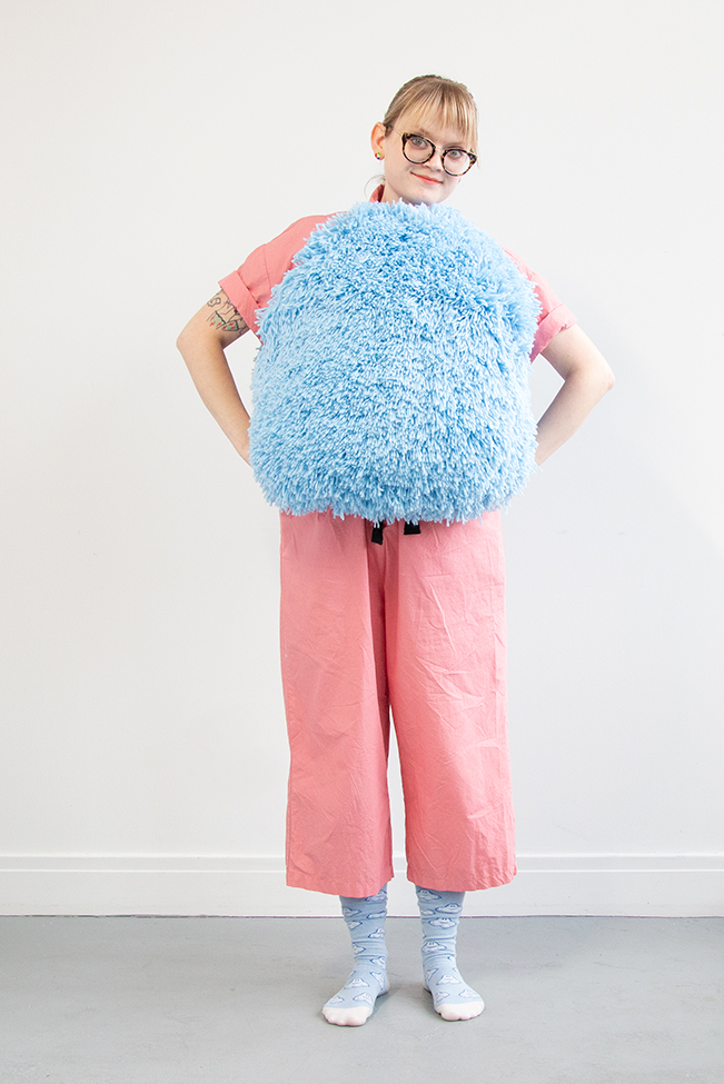 I got this wild idea to make a giant pom pom costume using latch hook, so I gave it a go for Halloween. Take a closer look at this three dimensional rug-making project and its construction. 