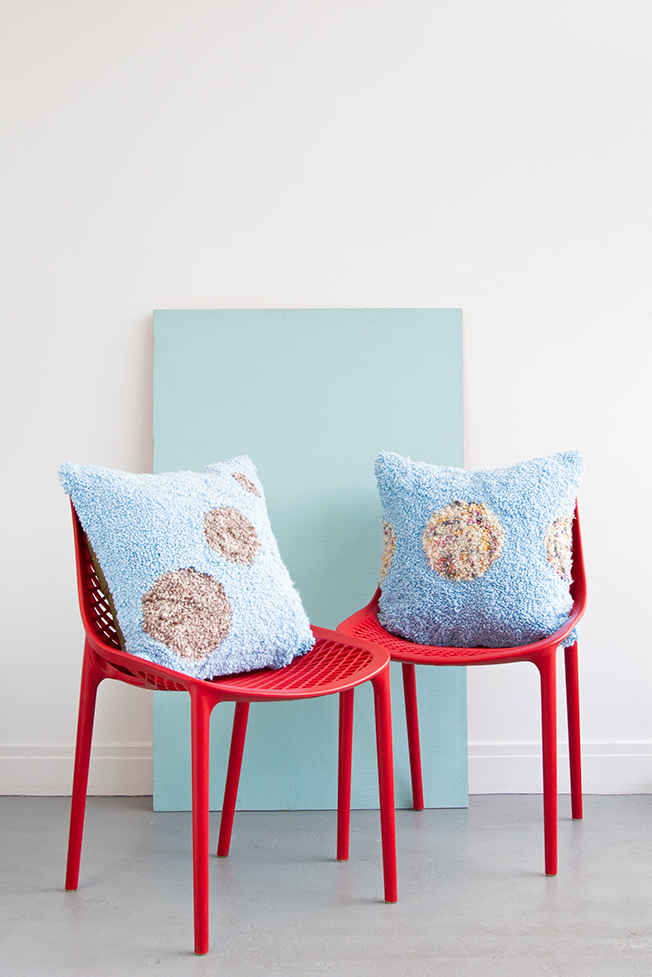 Learn how to make these planet-inspired punch needle throw pillows using embroidery hoops!